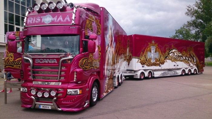 Pink Scania R-series truck with custom trailer