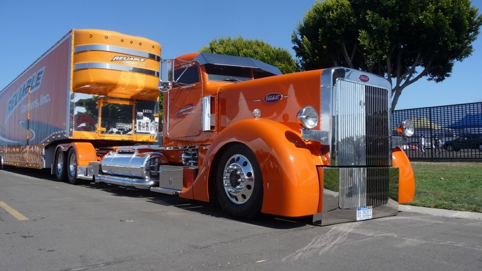 Orange Peterbilt Truck with Reliable Trailer