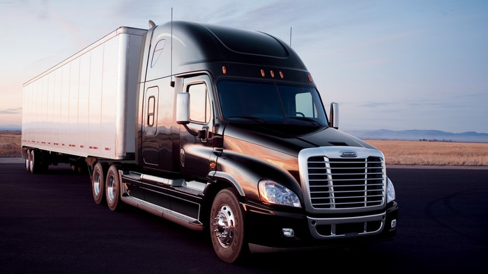 Black Freightliner Cascadia Semi-Truck with Trailer