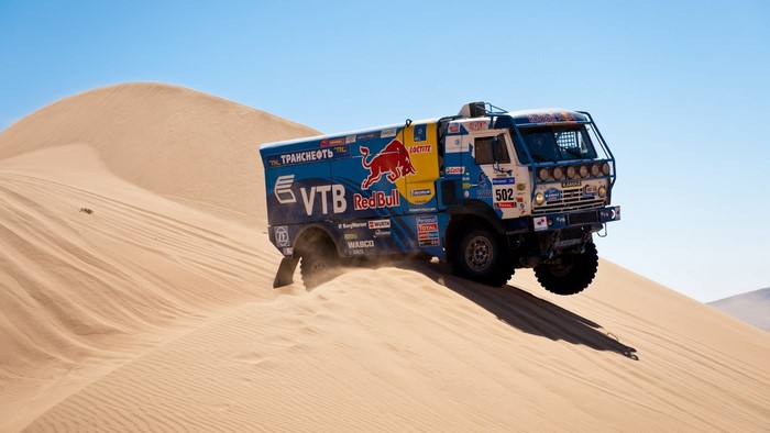 KAMAZ truck racing on sand dunes