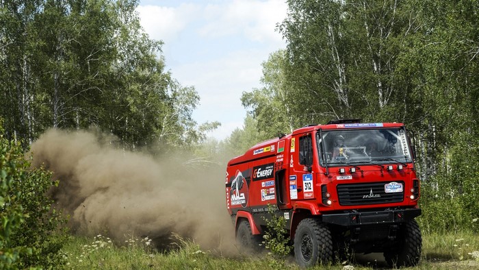 Red MAZ 5309 RR truck racing through a forest