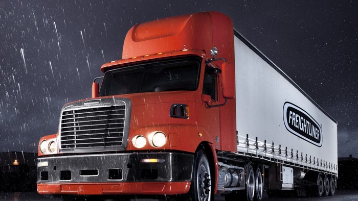 Orange Freightliner Truck in Rain