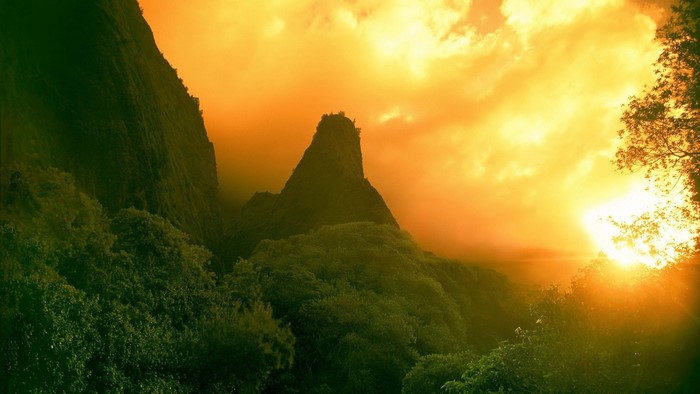 Sunset over a jungle landscape with mountains