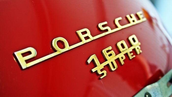 Porsche 1600 Super emblem on red car