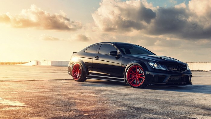 Black Mercedes-Benz C63 Coupe with Red Wheels