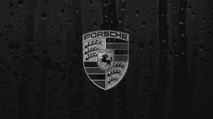 Porsche Emblem on Water Droplet Background