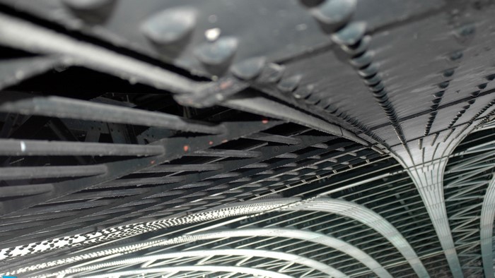 Underneath a bridge structure with metal beams