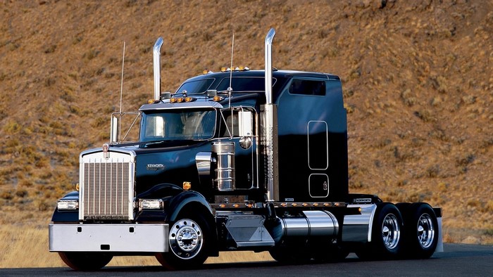 Black Kenworth Semi-Truck on a Road