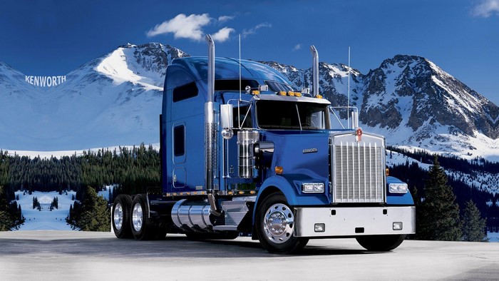 Blue Kenworth Truck in Snowy Mountains