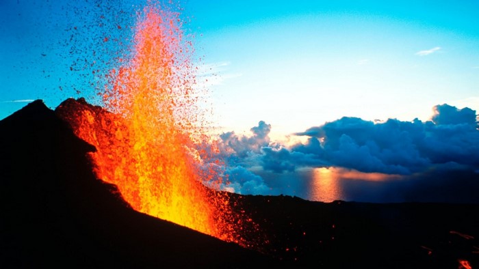 Volcanic eruption with lava spewing into the sky