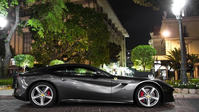 Silver Ferrari parked at night