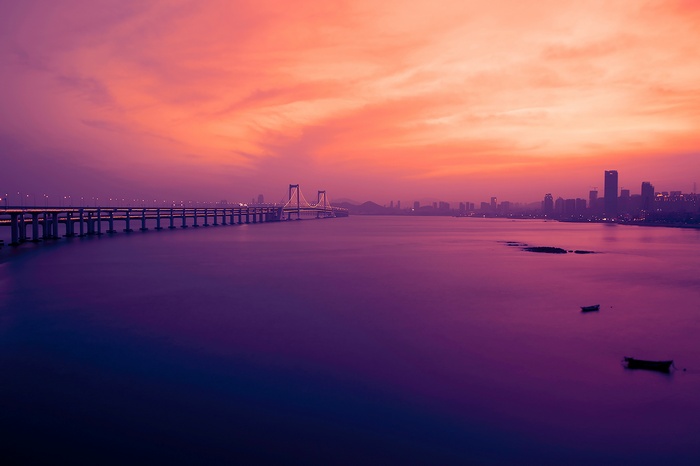 Sunset over Xinghai Bay Bridge in Dalian, China
