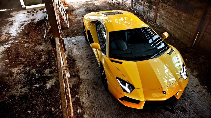 Yellow Lamborghini Aventador in a Barn