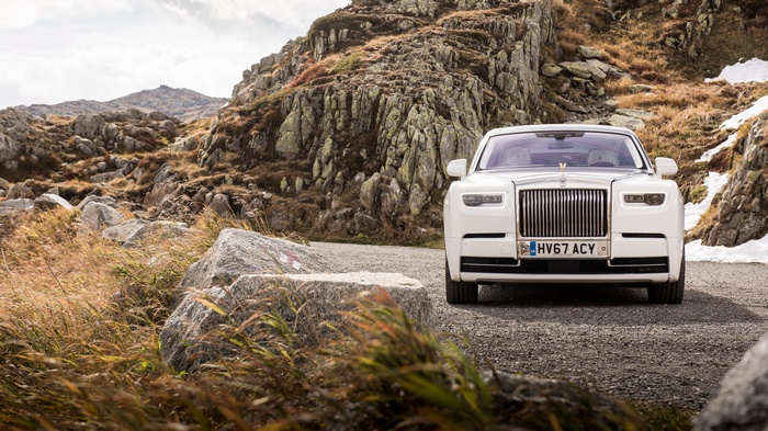 White Rolls-Royce Phantom on a rocky mountain road