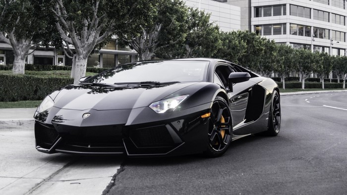Black Lamborghini Aventador parked on street
