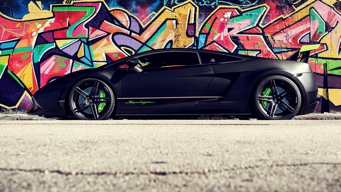 Matte black Lamborghini Gallardo Super Trofeo Stradale with graffiti