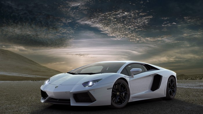 White Lamborghini Aventador on a dirt road