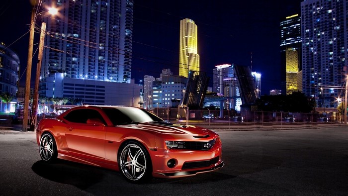 Red Chevrolet Camaro in City at Night