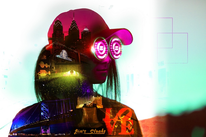 Double exposure of person with goggles, Philadelphia skyline, and bridge