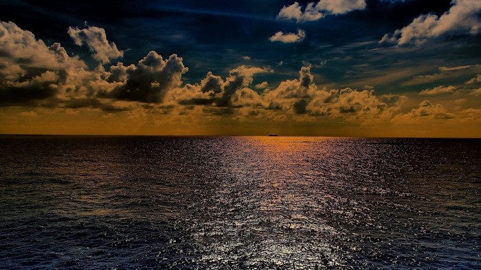 Ship on the Horizon at Sunset