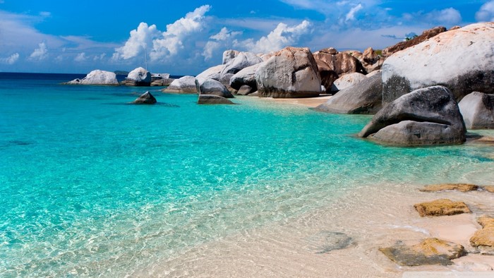 Tropical Beach with Turquoise Water and Large Rocks