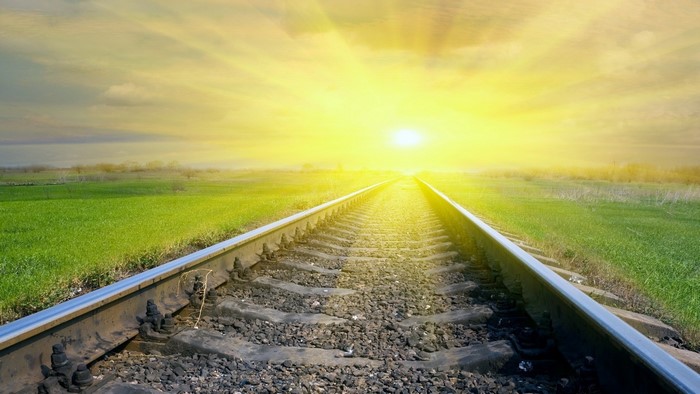Sunrise Over Railroad Tracks