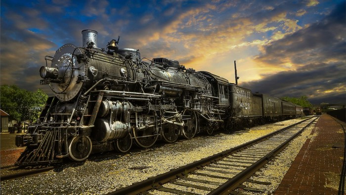 Steam Locomotive on Train Tracks