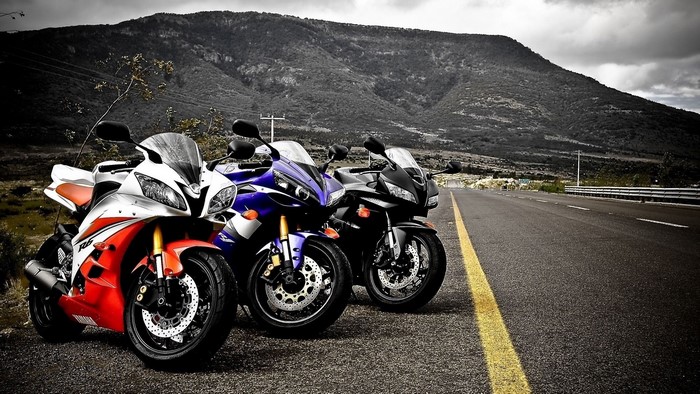Yamaha, Kawasaki, and Honda Racing Motorcycles on Road