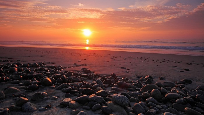 Sunset over a rocky beach
