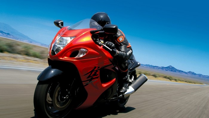 Red Suzuki Hayabusa motorcycle on a desert road
