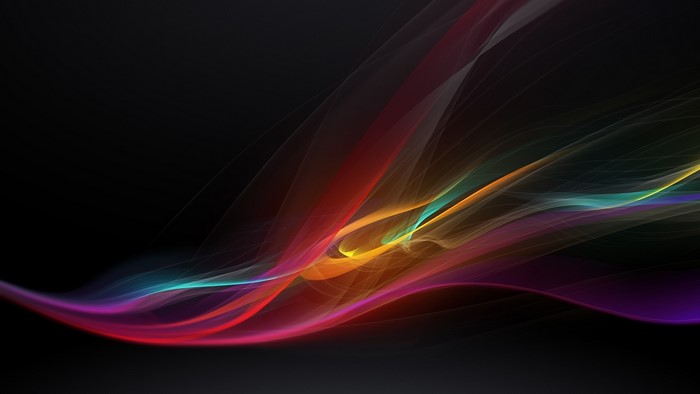 Abstract colorful light streaks on black background