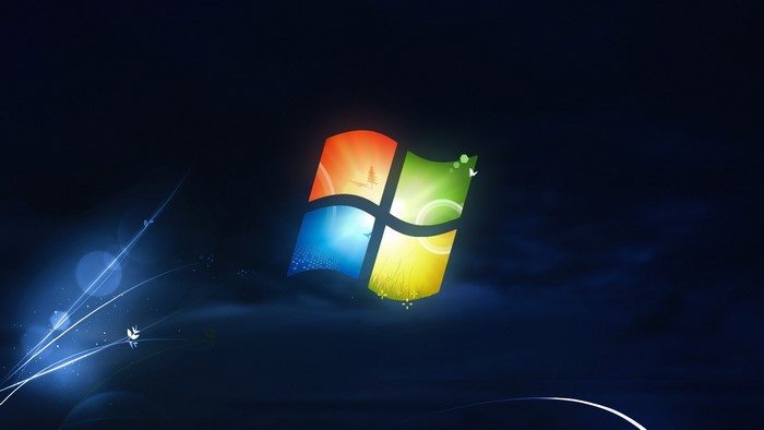 Windows logo with abstract blue light streaks