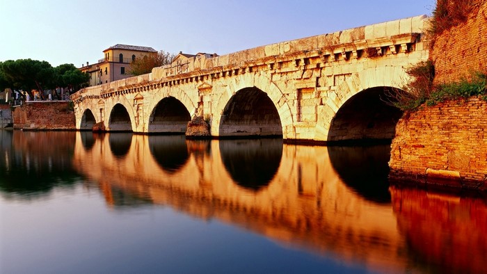 Tiberios Bridge over water with reflections