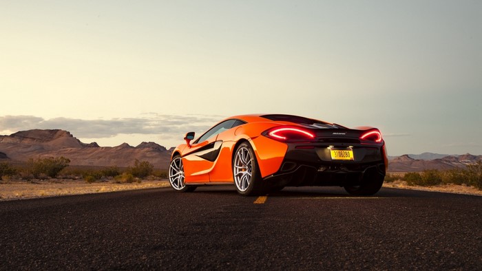 Orange McLaren 570S on a Desert Road