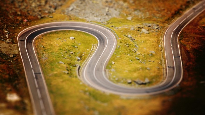 Winding mountain road with white lines