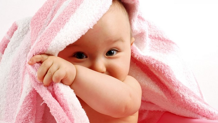 Cute Baby Wrapped in Pink and White Towel