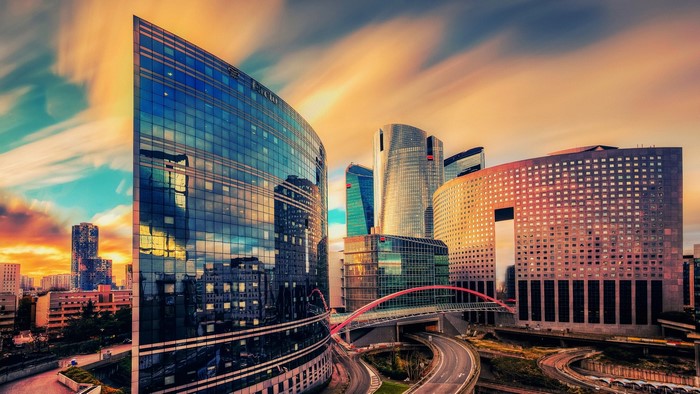 Modern skyscrapers in La Defense, Paris, France at sunset