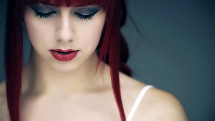 Woman with red hair and makeup