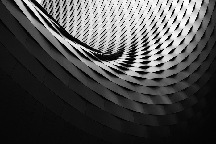 Abstract architectural facade with repeating diamond pattern