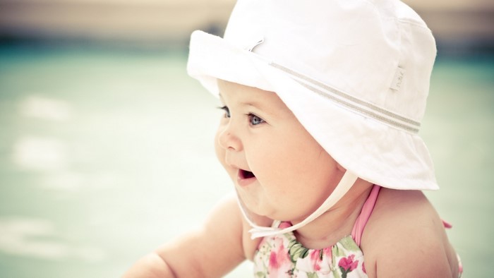 Cute Baby Wearing White Hat