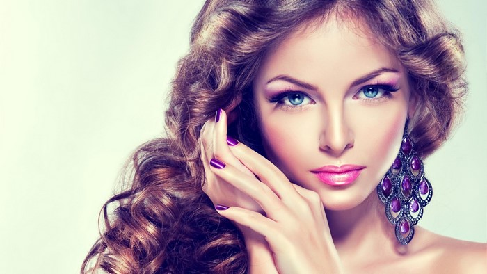 Woman with blue eyes and purple accessories