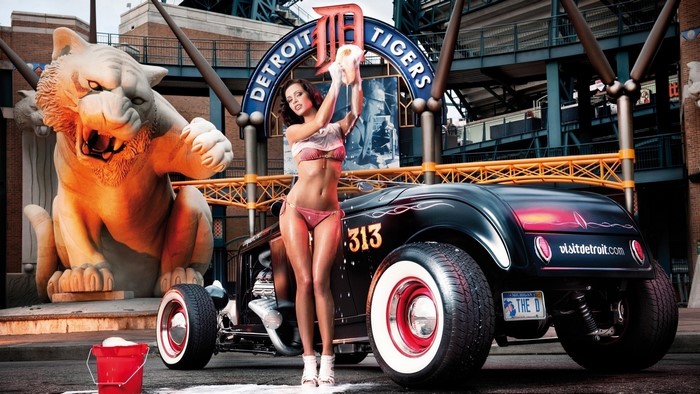 Kristin Zippel washes a hot rod in front of Detroit Tigers stadium