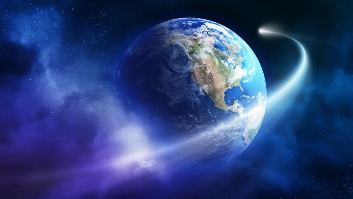 Planet Earth with a comet streaking by