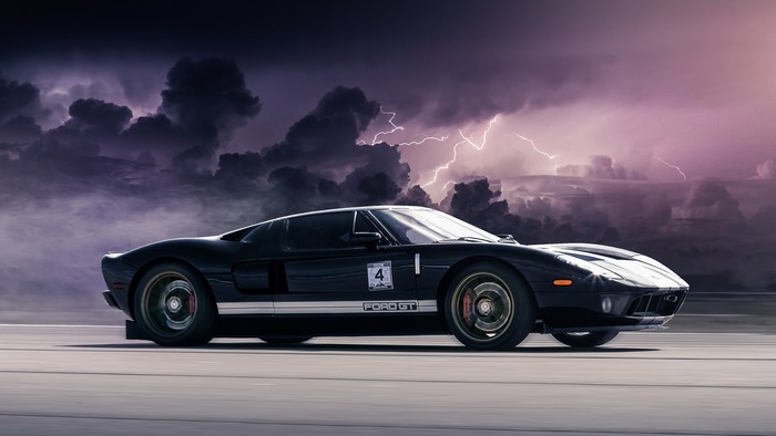 Black Ford GT with lightning in the background