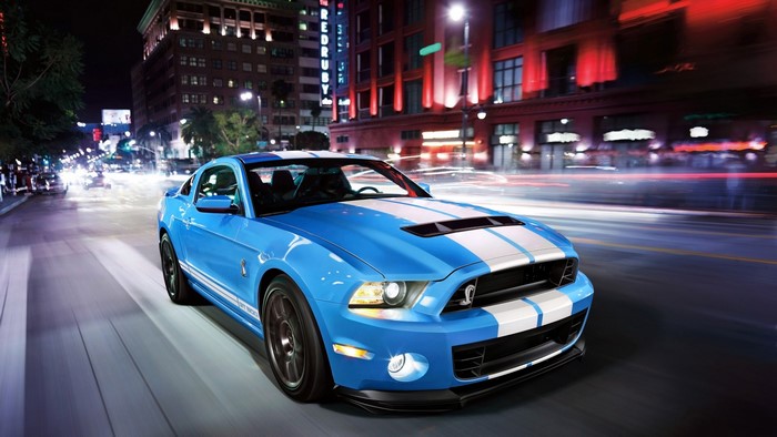Blue Ford Shelby GT500 driving at night
