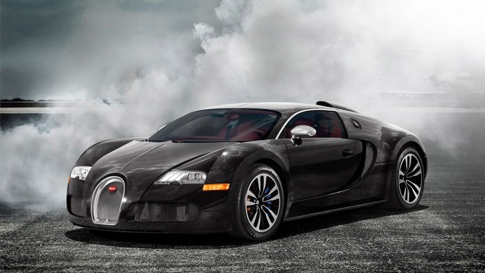 Black Bugatti Veyron Sang Noir on a smoky road