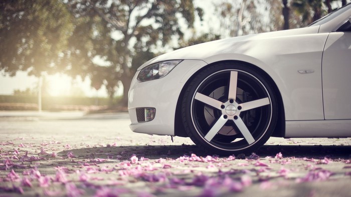 White BMW 3 Series car wheel close-up