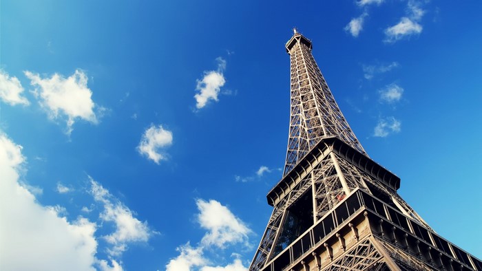 Eiffel Tower in Paris under a blue sky