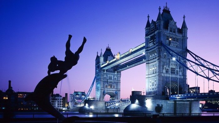 Statue and Tower Bridge at dusk