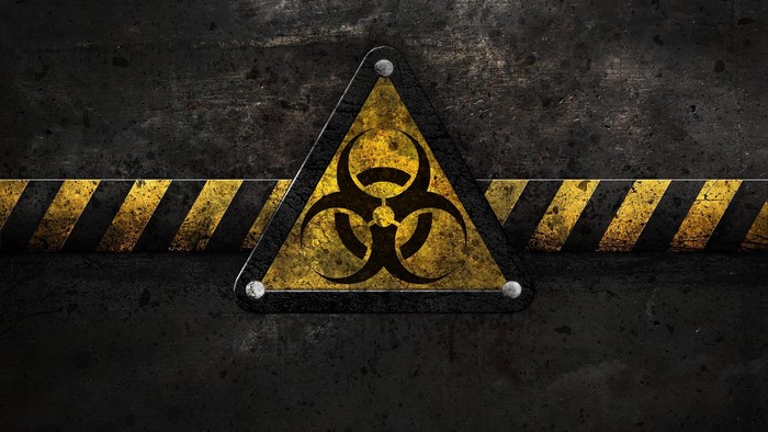 Biohazard symbol on a warning stripe background